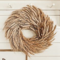 a close up of a brown and white scarf on top of a wooden door frame