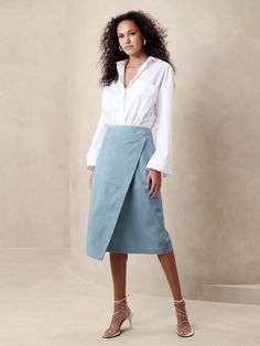 We opted for the simplified silhouette of a modern, wrap shape for this suede skirt—the better to showcase this luxurious material and its rich, seaglass-blue hue.  Column fit.  Wrap construction with concealed button and tie closure.  Side pockets.  Unlined. Office Skirt And Blouse, White Denim Skirt, Banana Republic Skirt, Wool Mini Skirt, Pencil Skirt Outfits, Chic Skirts