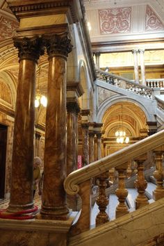 an ornate staircase in a large building