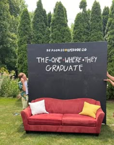 two people standing in front of a blackboard with the words the one where they graduate