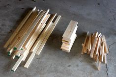 several pieces of wood sitting on the ground next to each other, all being assembled