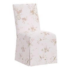 a white chair with pink flowers on the back and seat cover in front of it