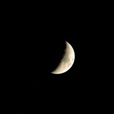 the half moon is seen in the dark sky with no light on it's side