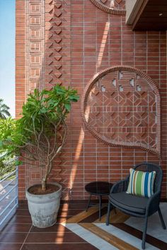 a chair and potted plant on the balcony