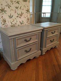 two gray dressers sitting on top of a hard wood floor