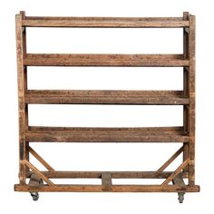 an old wooden crate with wheels on a white background