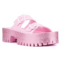 For effortless summer style from beach to boardwalk, slip into our Sparkles slide sandal. Its glitter finish adds a touch of illumination to the double-strap upper, complemented by a sturdy lug sole for comfort and traction. Perfect for casual outings or seaside adventures, the Sparkles sandal combines chic design with practicality, ensuring you shine brightly wherever you go this summer. Pink Slides With Textured Footbed, Pink Textured Footbed Slides, Pink Platform Jelly Sandals For Beach, Pink Textured Footbed Sandals For Summer, Pink Slide Footbed Sandals For The Beach, Pink Glitter Sandals For Spring, Trendy Pink Platform Slides, Pink Party Slides For Summer, Pink Slide Footbed Sandals For Spring