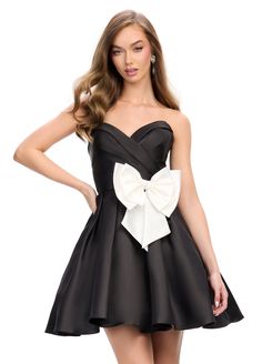 Indulge in luxury with the Ashley Lauren 4783 Cocktail Dress. Featuring a sweetheart neckline and ruched bodice, this dress will enhance your curves. The A-line skirt is made of Mikado fabric and is adorned with a bow at the hip, adding an elegant touch to this sophisticated look. Colors: White, Black (white bow), Red Sizes: 0-16 Christmas Party Dresses Classy, Big Bow Dress, Cocktail Attire For Women, Party Dresses With Sleeves, Ashley Lauren, Single Dress, Strapless Cocktail Dress, Strapless Sweetheart Neckline, Club Party Dresses