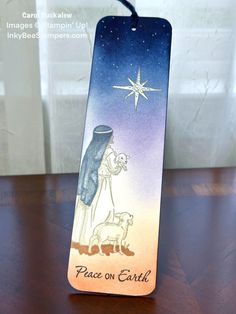 a bookmark with an image of the nativity scene and a star above it