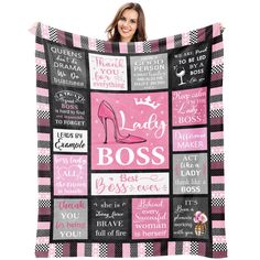 a woman holding up a pink and black blanket with the words, lady boss on it