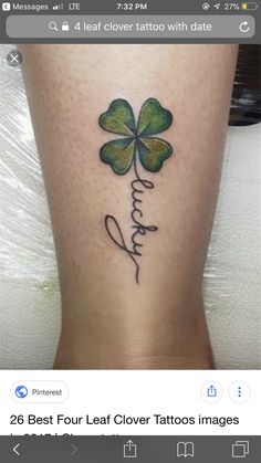 a woman's leg with a four leaf clover tattoo on it