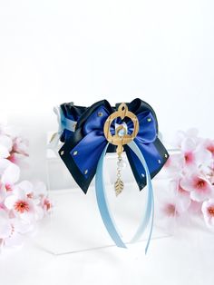 ♡ Inspired by character Scaramouche/ Wanderer from Genshin Impact♡ 38mm thickness♡ Made from high quality satin material♡ Not designed for tugging or leash attachments♡ Collar is adjustable♡ D-ring ribbon closure♡ Gold hardware usedAdd on details:♡ Handmade bows♡ Handmade faux leather cutout of scaramouche's accessory♡ Blue and gold rhinestones♡ White solid pearl and gold leaf charms Collar measurements:♡ Our collars are measured from the start and end of each D-rings. Each D-ring takes up about 1 inch eachNote:♡ This listing is a sale for the collar only. Matching bows are sold separately♡ Due to the nature of handmade items, there may be minor imperfections♡ All faux leather shapes, bows, small and large are all handmade♡ All Kahweiei items are purely made for accessorising and wearing a Scaramouche Wanderer, Hair Accessories Clips, Mini Bows, Bow Set, White Solid, Handmade Bows, Leaf Charms, Gold Rhinestone, Satin Material