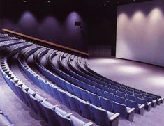 an empty auditorium with rows of seats