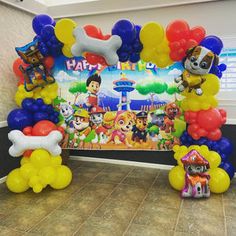 the balloon arch is decorated with paw patrol characters