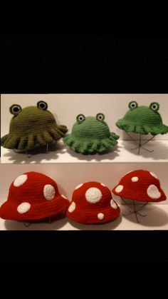 four knitted toad hats with eyes and hands on top of each other, sitting next to each other