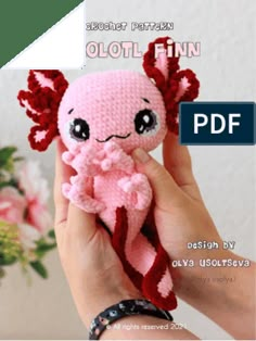 a hand holding a pink stuffed animal in it's right hand with the caption, crochet pattern