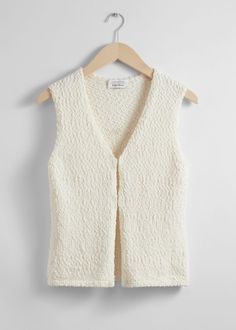 Knitted vest vest secured with duo hook closures.• Slim fit• V-cut neckline• Length of vest:53.5cm / 21.1" (Size S) Knit Vests, Knitted Waistcoat, Woven Leather Sandals, Summer Style Guide, Strappy Mini Dress, Feminine Fashion, Wide Trousers, Knitted Vest, Vest White