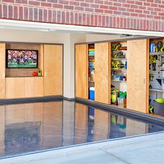 the garage is clean and ready to be used as a storage area for sports equipment