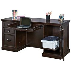 a laptop computer sitting on top of a wooden desk next to a printer and file cabinet