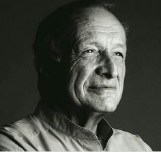 an older man is posing for a black and white photo with his eyes wide open