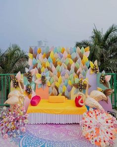 an elaborate bed decorated with paper flowers and flamingos