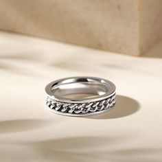 Made from high-quality 925 sterling silver, this band perfectly combines style with function. The rotating design adds a fun element to this band. Each turn symbolizes the memories and experiences that have shaped you into the extraordinary individual you are today. Wear this band with pride. Because it represents your commitment to embracing life’s journey and cherishing the moments that matter most.Weight: 4 gWidth: 5 mmHeight: 2.3 mmThickness: 2 mmMaterial: 925 SilverPlating Color: Silver Classic Silver Chain Ring With Adjustable Size, Silver Adjustable Chain Classic Ring, Classic Silver Chain Ring With Adjustable Chain, Classic Silver Chain Ring Adjustable, Engraved Stainless Steel Chain Link Jewelry, Silver Stainless Steel Chain Promise Ring, Silver Sterling Chain Ring Tarnish Resistant, Minimalist Silver Chain Ring For Anniversary, Modern Sterling Silver Chain Ring In White Gold