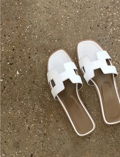 White Oran Hermès sandals Hermes Oran Sandals, Casual Summer Sandals, Luxury Lifestyle Girly, Shoes Photography, Street Shoes, Shoe Inspiration, Shoe Inspo, Kinds Of Shoes