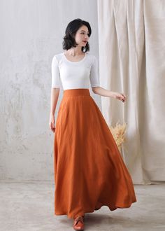 "You'll feel ultra chic and modern wearing the A Line skirt throughout the year, the long skirt will be a prefect on for your summer autumn. DETAIL * More colors available https://etsy.me/3ifY3Py * 100% pure linen * Two side pockets * Right Hidden Zipper closure * Back elastic waistband * Maxi linen skirt, long linen skirt, Plus size Skirt * Ankle length effect * Perfect for Summer, spring and Autumn * Machine Washable in Warm/Cold Water/Do not bleach /Mid-iron /Hang Dry *The model is 170 cm (5′ Fitted Orange Skirt, Fitted Orange Pleated Skirt, Chic Stretch Orange Skirt, Non-stretch Long Lined Skirt, Elegant Orange Skirt For Spring, Elegant Orange Flowy Skirt, Flowy Flared Orange Skirt, Relaxed Orange Maxi Skirt, Orange Relaxed Flared Skirt