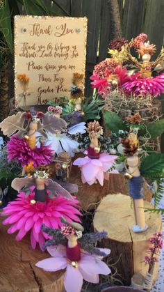 flowers and fairy figurines are on display