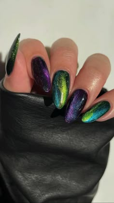 Purple And Green Cat Eye Nails, Green And Purple Cat Eye Nails, Black Purple Green Nails, Green And Purple Halloween Nails, Green And Purple Nail Designs, Purple And Green Halloween Nails, Black Iridescent Nails, Green And Purple Nails, Green Cat Eye Nails