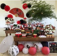 a table topped with lots of desserts and decorations