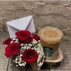 starbucks coffee and red roses with an envelope