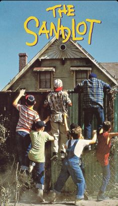 the sandlot movie poster with kids jumping in front of an old house and scarecrow