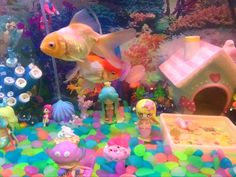 an aquarium filled with lots of different types of toys