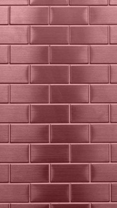 a red brick wall that has been painted in metallic colors and is being used as a background