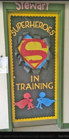 a sign on the wall that says, stewart superheros in training and then more doors so i can decorate it