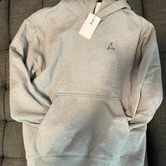 Jordan Essentials Fleece Pullover Hoodie. Men’s gray. NWT Jordan Hoodie, Jordan Essentials, Jumpman Logo, Men's Hoodies, Hoodie Men, Birthday Wishlist, Nike Hoodie, Pullover Designs, Streetwear Outfit