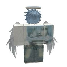 a paper model of an angel with wings on it's head, standing in front of a mirror