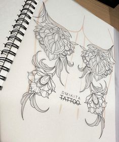 an open notebook with some drawings on it and the words dimita tattoo written in black ink