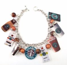 a bracelet with starbucks coffee charms and other items on the link to make it look like they have been made into a charm