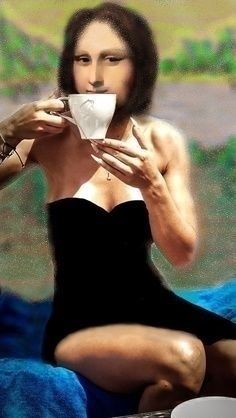 a woman in a black dress drinking from a cup