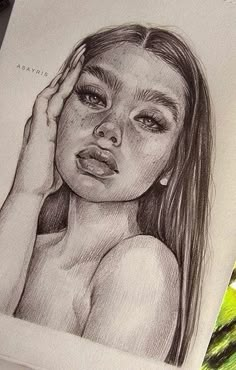 a pencil drawing of a girl with her hand on her head