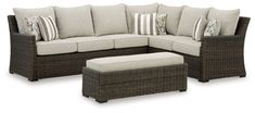 an outdoor sectional set with cushions and footstools