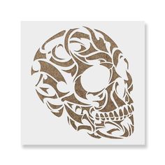 a paper cut out of a skull with an intricate design on the front and side