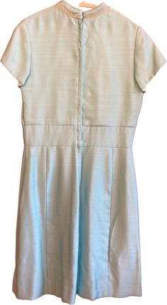 Gorgeous ‘50s-‘60s dress, so Jackie O! Sky blue color, gemstone neckline detail, perfect for a cocktail party or holiday dinner. Excellent condition. One small mark at back neck closure (see photo). Detailed measurements (taken with garment lying flat and doubled):Bust - 41”Waist - 34”Body Length - 38”Hip - 46” 60s Cocktail Dress, Sky Blue Color, Jackie O, 60s Dress, Holiday Dinner, Blue Shorts, Back Neck, Cocktail Party, Sky Blue