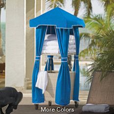 a blue and white gazebo sitting on top of a patio next to a pool