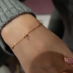 Tiny Diamond Cross Bracelet! 14K Gold Bracelet! Bridesmaid Bracelet! Minimalist Diamond Bracelets are loved by women. All items in our store are 100 % handmade products. Don't forget to add the store to your favorites to be informed about discounts. We recommend that you remove your jewelry before doing any activity that may be considered abrasive. ❤️All products are made with love, labor and care. They bring you the best wishes. 🎁 All products are sent in special packages. Custom white wooden Gold Cross Bracelet For Everyday Wear, Gold Cross Bracelets For Gifts, Handmade Gold Bracelet With Cross Shape, Gold Hypoallergenic Cross Bracelet, Elegant Metal Cross Bracelet, Dainty Gold Bracelet, Birthday Bracelet, Everyday Bracelet, Bracelet Minimalist