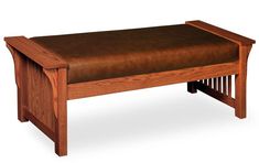 a wooden bench with brown leather seat cushion