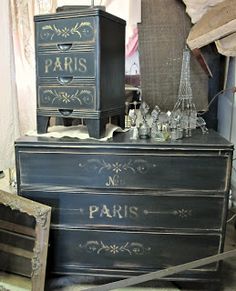 an old dresser with glass bottles on it