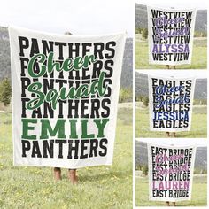 a group of people standing in a field holding up a large white banner with words on it